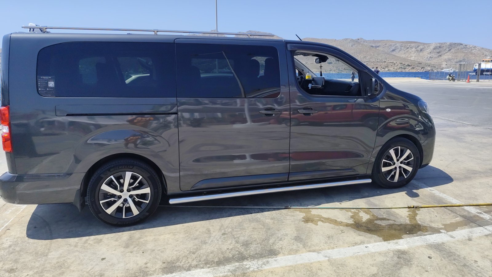 Michalis's private taxi van ready by the port in Leros